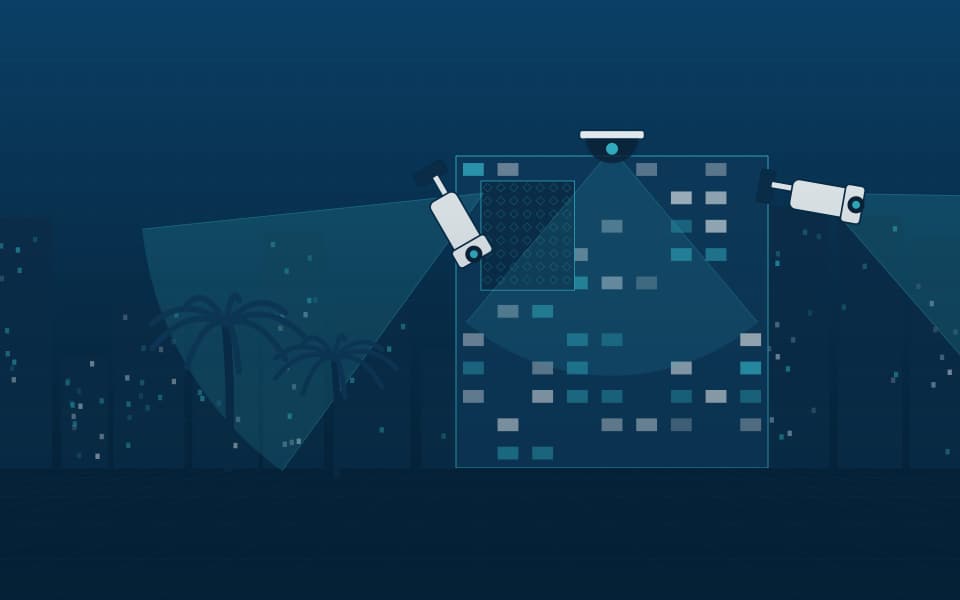 Building facade with external cameras covering the approaches, at night