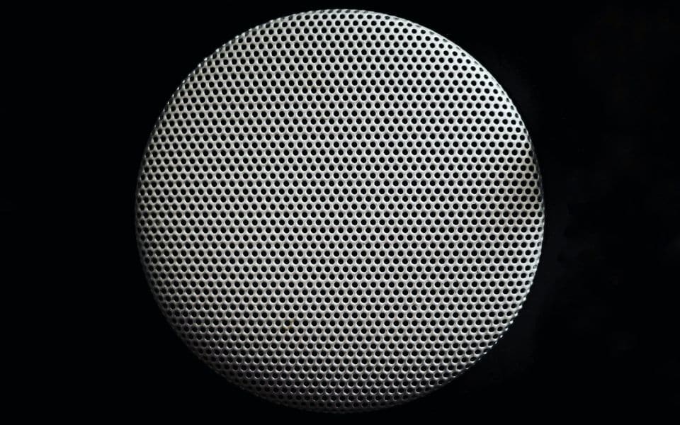 A flush-mounted architectural ceiling loudspeaker for public address
