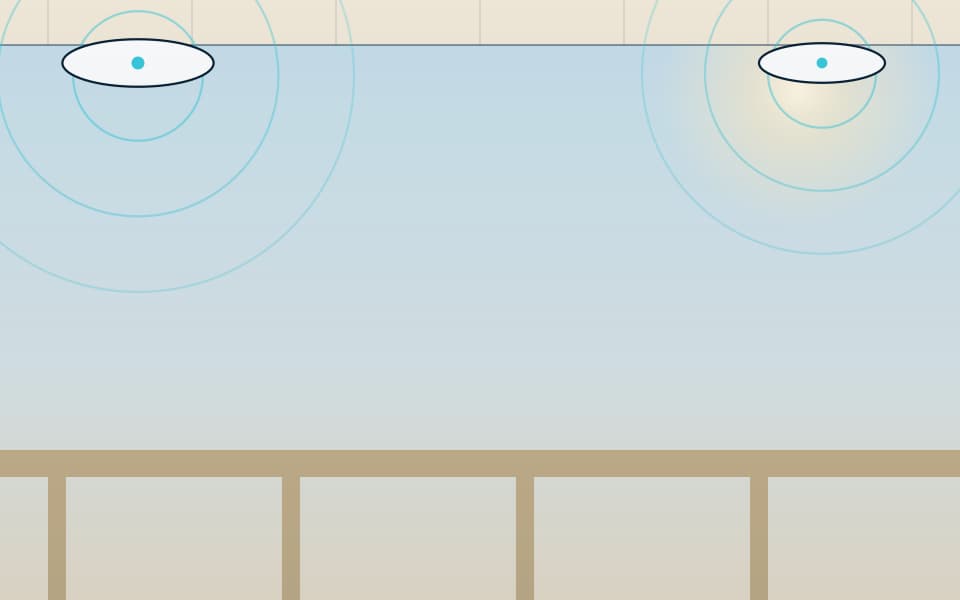 Ceiling Wi-Fi access points over a work area (detail), in daylight